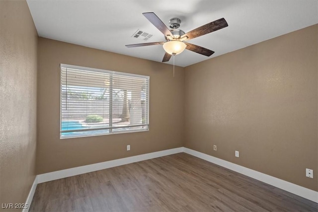 9794 Ice Box Canyon Ct, Las Vegas, NV 89117 - unfurnished room with wood finished floors and a ceiling fan
