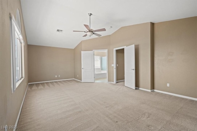 9794 Ice Box Canyon Ct, Las Vegas, NV 89117 - unfurnished bedroom featuring lofted ceiling, light carpet, ensuite bath, and ceiling fan