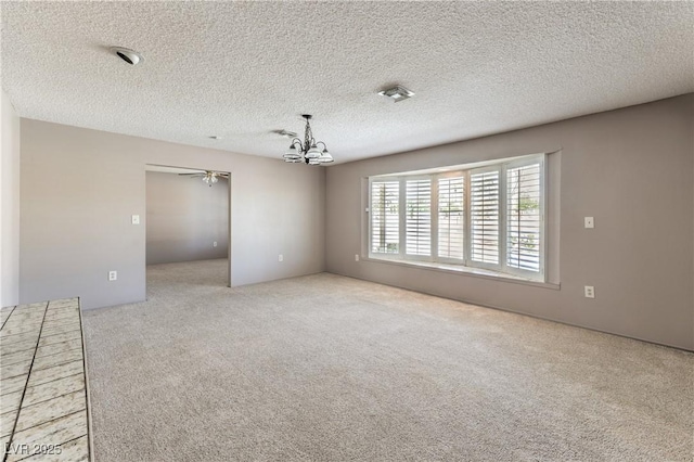 2780 Montessouri St, Las Vegas, NV 89117 - carpeted empty room with a chandelier, a textured ceiling, and ceiling fan