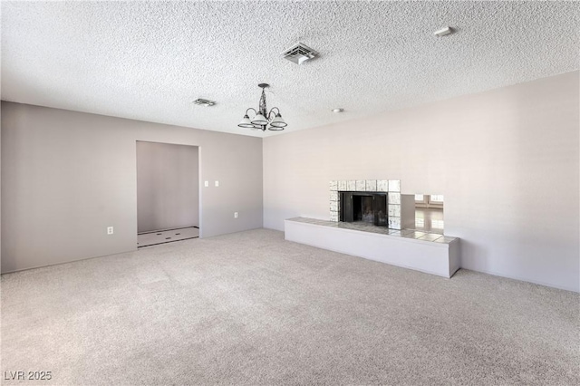 2780 Montessouri St, Las Vegas, NV 89117 - unfurnished living room featuring carpet floors, a chandelier, a fireplace, and a textured ceiling