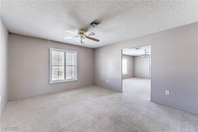 2780 Montessouri St, Las Vegas, NV 89117 - spare room featuring carpet floors, a ceiling fan, a chandelier, and a textured ceiling