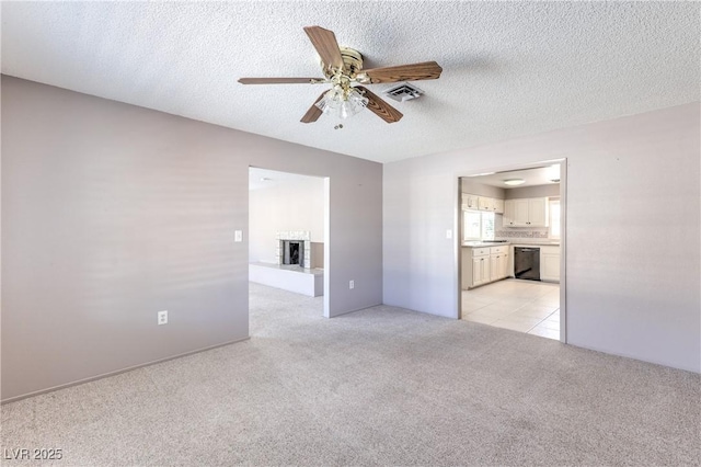 2780 Montessouri St, Las Vegas, NV 89117 - empty room featuring light carpet, ceiling fan, and a textured ceiling
