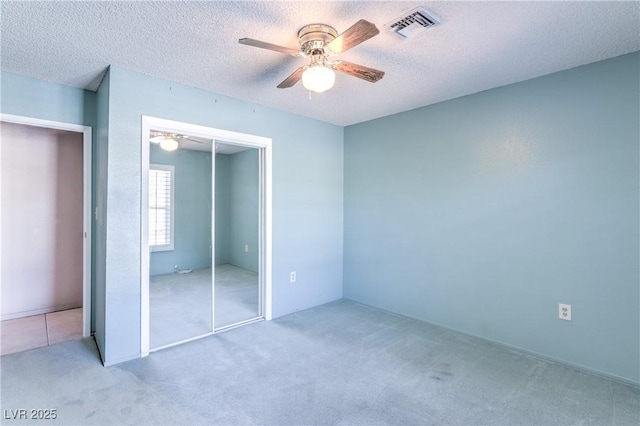 2780 Montessouri St, Las Vegas, NV 89117 - unfurnished bedroom with carpet flooring, a closet, a textured ceiling, and a ceiling fan