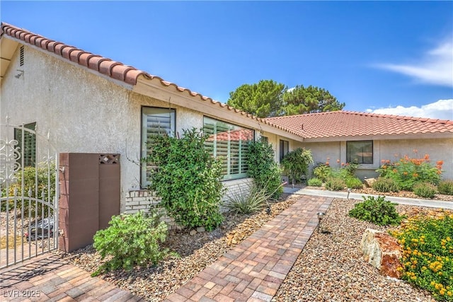1605 Siboney Dr, Las Vegas, NV 89123 - view of side of property featuring stucco siding and a tile roof