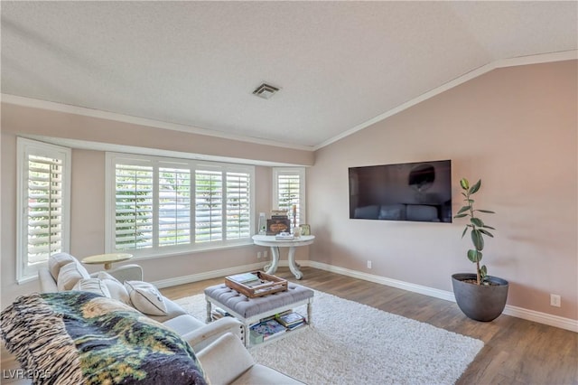 1605 Siboney Dr, Las Vegas, NV 89123 - living room featuring vaulted ceiling, wood finished floors, and ornamental molding