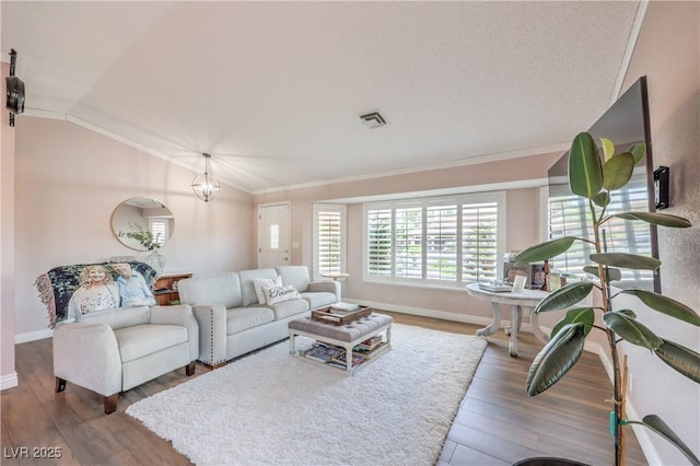 1605 Siboney Dr, Las Vegas, NV 89123 - living room featuring wood finished floors, ornamental molding, and lofted ceiling