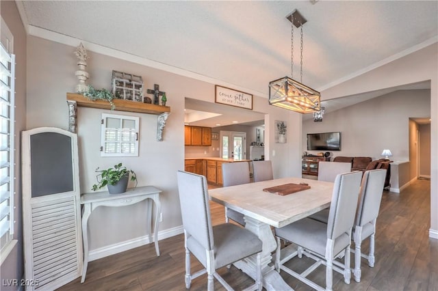1605 Siboney Dr, Las Vegas, NV 89123 - dining area with dark wood finished floors, vaulted ceiling, ornamental molding, and a chandelier