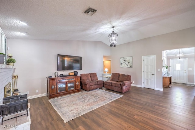 1605 Siboney Dr, Las Vegas, NV 89123 - living room with dark wood-style floors, a chandelier, and vaulted ceiling