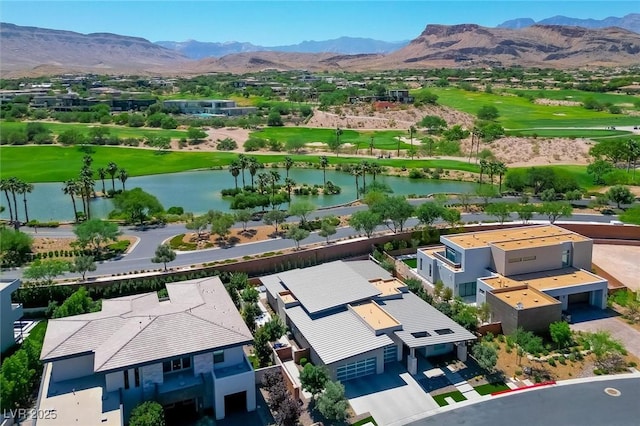 11 Hawkeye Ln, Las Vegas, NV 89135 - aerial perspective of suburban area featuring a golf course and a water and mountain view