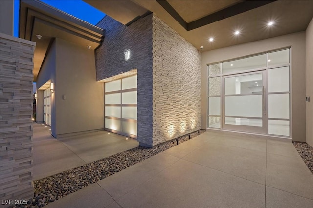 11 Hawkeye Ln, Las Vegas, NV 89135 - building lobby featuring a high ceiling, recessed lighting, and a security system
