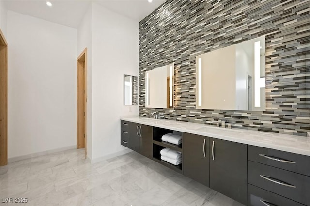 11 Hawkeye Ln, Las Vegas, NV 89135 - full bath featuring double vanity, backsplash, marble finish flooring, and recessed lighting