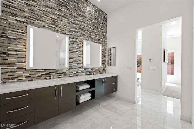 11 Hawkeye Ln, Las Vegas, NV 89135 - bathroom featuring decorative backsplash, double vanity, and marble finish flooring