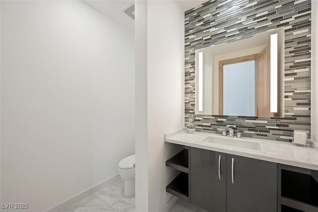 11 Hawkeye Ln, Las Vegas, NV 89135 - bathroom with marble finish flooring, decorative backsplash, and vanity