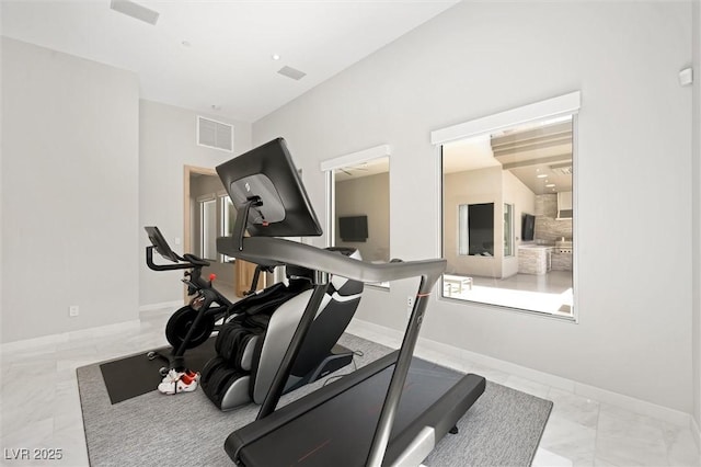 11 Hawkeye Ln, Las Vegas, NV 89135 - workout room featuring marble look tile flooring and baseboards