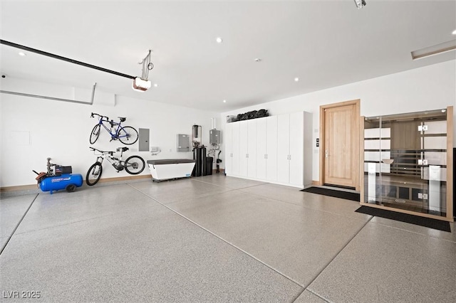 11 Hawkeye Ln, Las Vegas, NV 89135 - garage with a garage door opener, electric panel, and recessed lighting