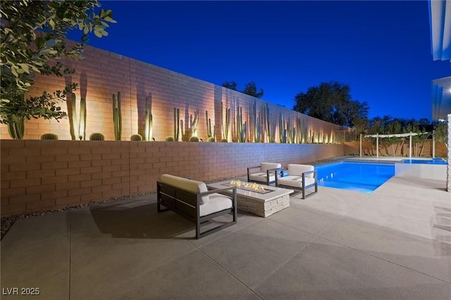 11 Hawkeye Ln, Las Vegas, NV 89135 - pool at night featuring an outdoor fire pit and a patio