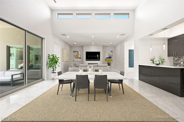11 Hawkeye Ln, Las Vegas, NV 89135 - dining space with light marble finish flooring and a towering ceiling