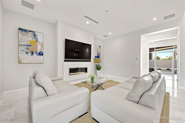 11 Hawkeye Ln, Las Vegas, NV 89135 - living area with recessed lighting, a glass covered fireplace, and light marble finish flooring