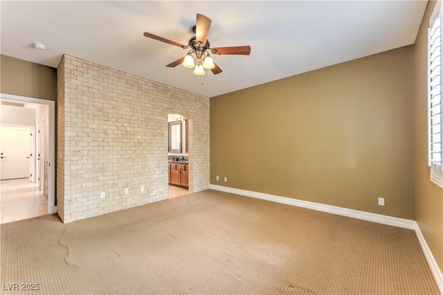233 Ventana Heights St, Henderson, NV 89074 - unfurnished room featuring brick wall, a ceiling fan, light colored carpet, and a smoke detector