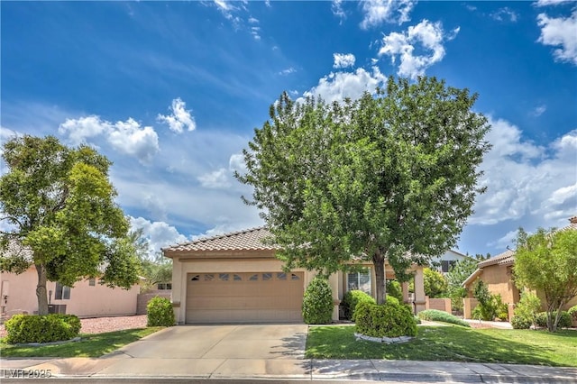 233 Ventana Heights St, Henderson, NV 89074 - view of front facade with stucco siding, an attached garage, concrete driveway, and a tiled roof