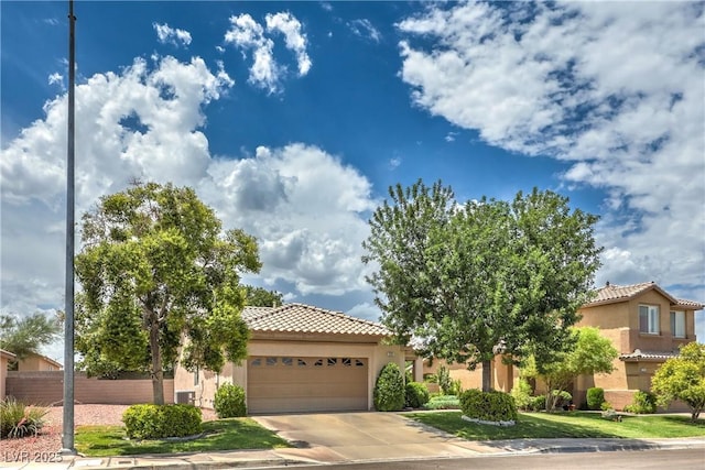 233 Ventana Heights St, Henderson, NV 89074 - view of front facade with a garage, a tiled roof, stucco siding, and concrete driveway