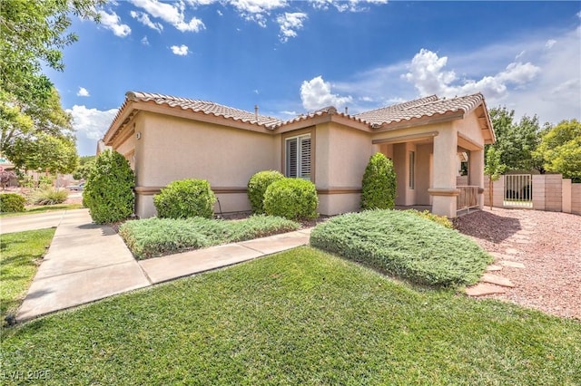 233 Ventana Heights St, Henderson, NV 89074 - mediterranean / spanish-style home featuring a tile roof, a gate, and stucco siding