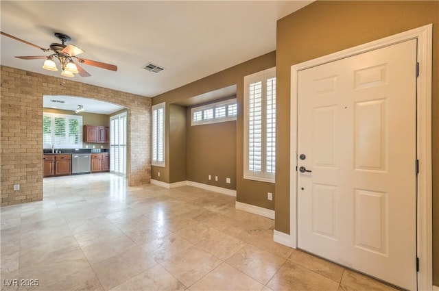 233 Ventana Heights St, Henderson, NV 89074 - entrance foyer with a ceiling fan, arched walkways, and light tile patterned floors