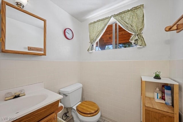 2169 Via Spes Nostra St, Mount Charleston, NV 89124 - bathroom with tile walls, vanity, and wainscoting