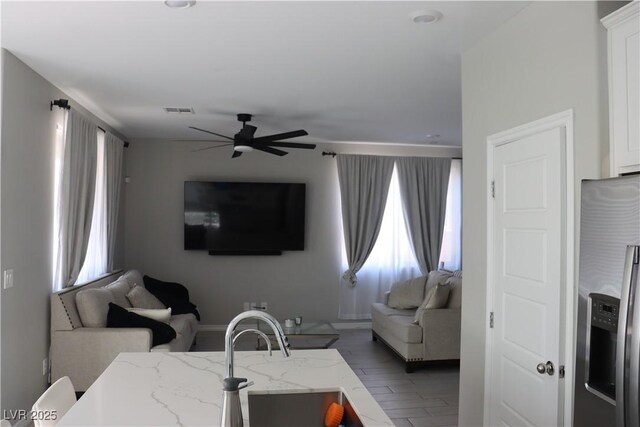 7022 Judith River St, North Las Vegas, NV 89084 - living area featuring a ceiling fan and wood finished floors