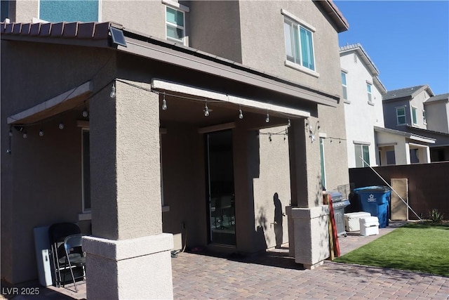 7022 Judith River St, North Las Vegas, NV 89084 - property entrance featuring stucco siding and a patio