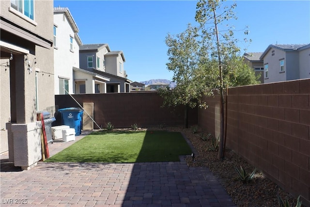 7022 Judith River St, North Las Vegas, NV 89084 - fenced backyard with a patio area and a residential view
