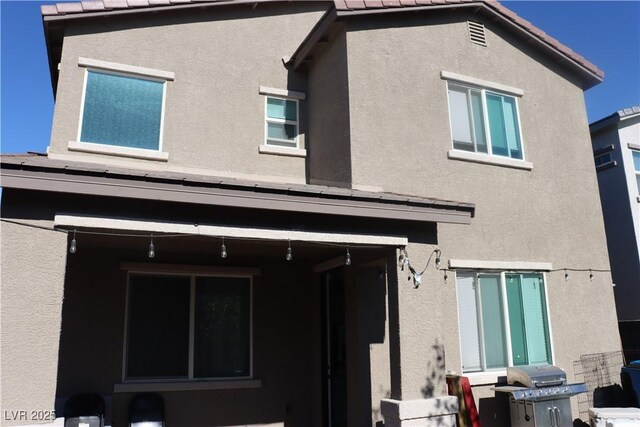 7022 Judith River St, North Las Vegas, NV 89084 - back of house featuring stucco siding