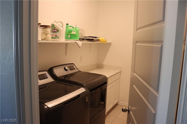 7022 Judith River St, North Las Vegas, NV 89084 - laundry room with washing machine and clothes dryer, cabinet space, and light tile patterned flooring