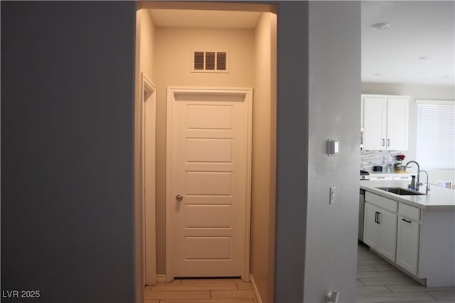 7022 Judith River St, North Las Vegas, NV 89084 - corridor featuring a sink