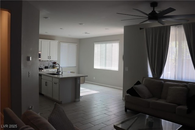 7022 Judith River St, North Las Vegas, NV 89084 - living area featuring baseboards and a ceiling fan