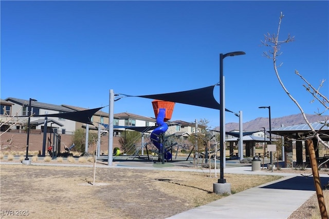7022 Judith River St, North Las Vegas, NV 89084 - view of playground featuring a residential view and a mountain view