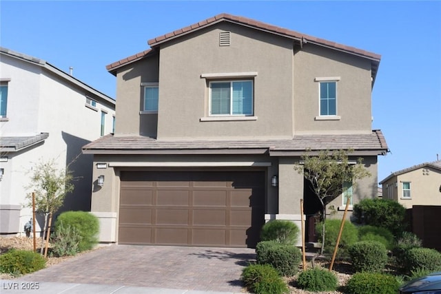 7022 Judith River St, North Las Vegas, NV 89084 - traditional-style house with an attached garage, stucco siding, decorative driveway, and a tiled roof