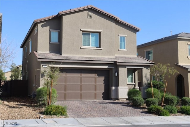 7022 Judith River St, North Las Vegas, NV 89084 - traditional-style house featuring stucco siding, an attached garage, decorative driveway, and a tile roof