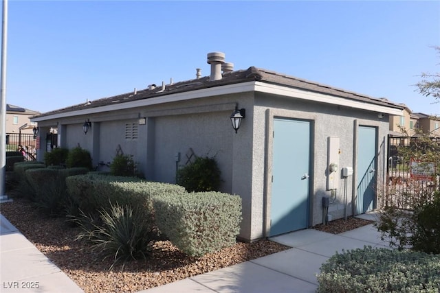 7022 Judith River St, North Las Vegas, NV 89084 - view of side of home with stucco siding