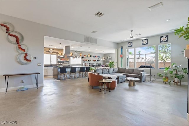 10596 Refugio St, Las Vegas, NV 89141 - living room with a ceiling fan and concrete flooring