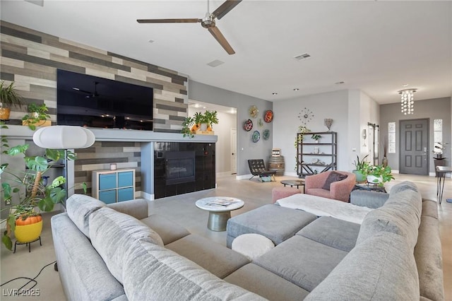 10596 Refugio St, Las Vegas, NV 89141 - living area featuring a ceiling fan and a tile fireplace