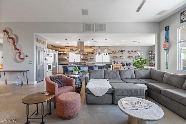10596 Refugio St, Las Vegas, NV 89141 - living room with concrete floors and recessed lighting