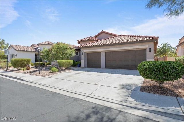 10596 Refugio St, Las Vegas, NV 89141 - mediterranean / spanish-style house featuring stucco siding, concrete driveway, an attached garage, and a tile roof