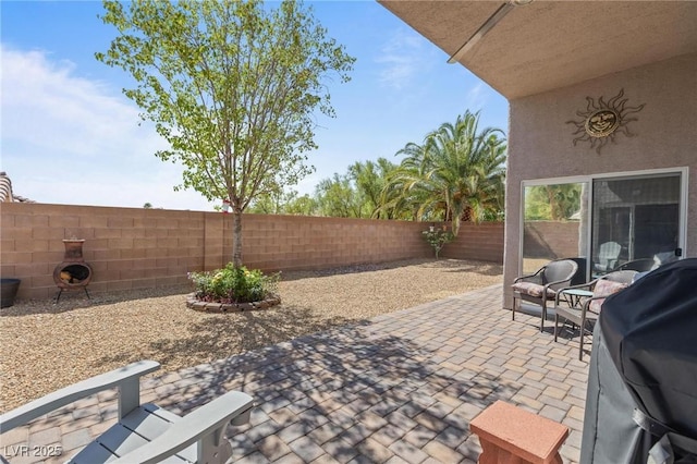10596 Refugio St, Las Vegas, NV 89141 - fenced backyard featuring a patio area and area for grilling