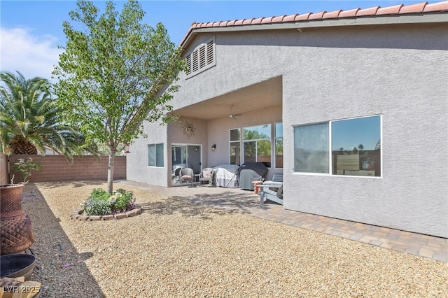 10596 Refugio St, Las Vegas, NV 89141 - back of house with stucco siding, a patio, a ceiling fan, and a fenced backyard