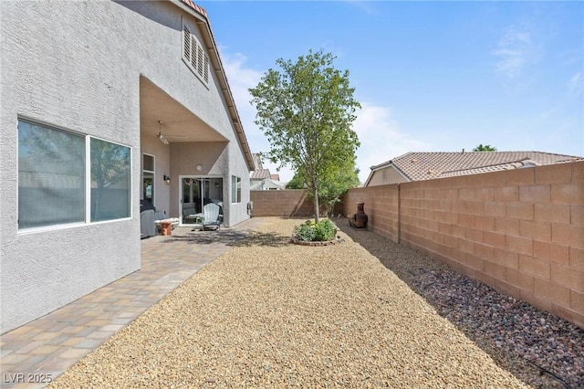 10596 Refugio St, Las Vegas, NV 89141 - fenced backyard featuring a patio area