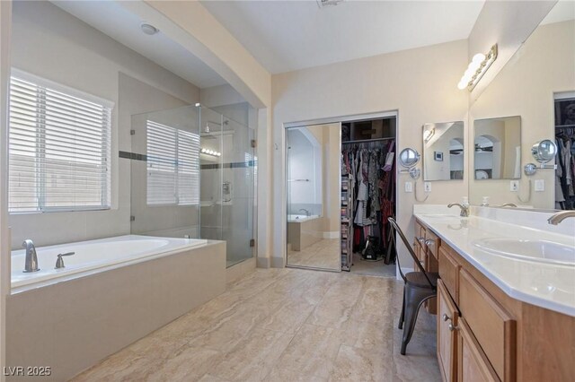 10596 Refugio St, Las Vegas, NV 89141 - full bath with a spacious closet, a stall shower, a garden tub, and double vanity