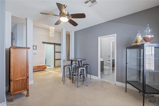 10596 Refugio St, Las Vegas, NV 89141 - dining space with carpet flooring, a ceiling fan, and a barn door