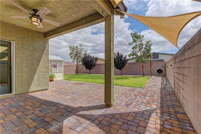 4441 Glossier Ave, North Las Vegas, NV 89084 - fenced backyard with a patio area and a ceiling fan