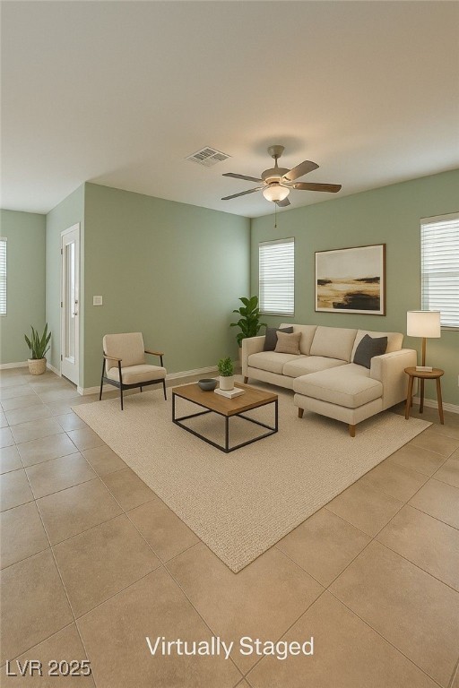 4441 Glossier Ave, North Las Vegas, NV 89084 - living area featuring light tile patterned floors, healthy amount of natural light, and a ceiling fan